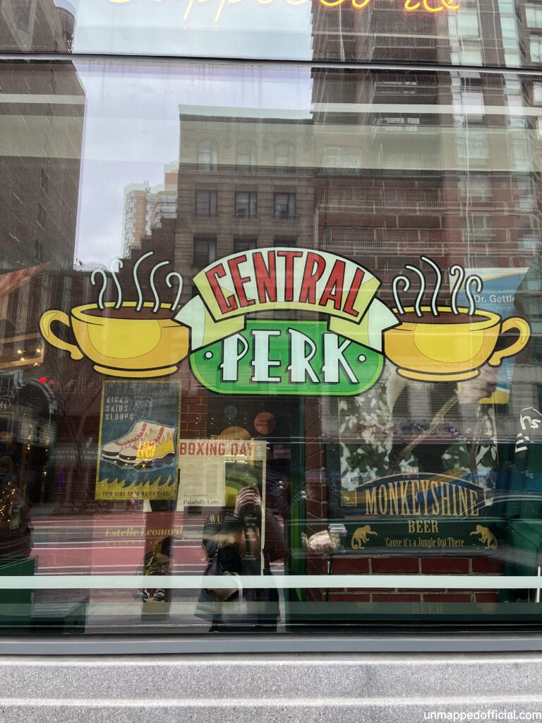 a window sign with the central perk logo