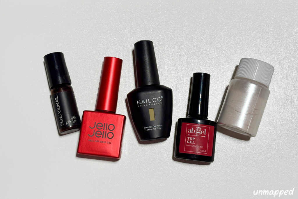 5 nail products laying on a white background