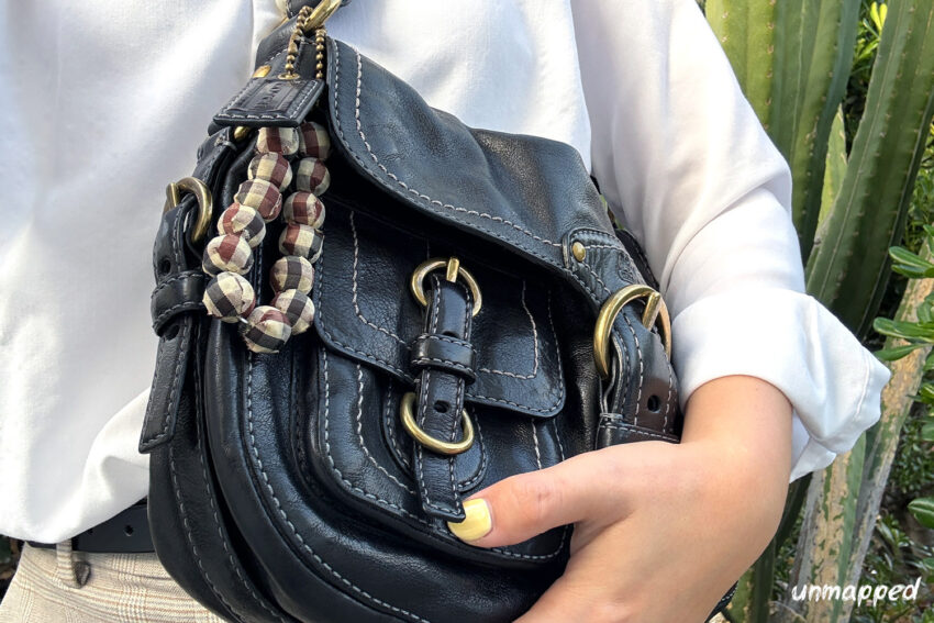 black purse work bag on shoulder