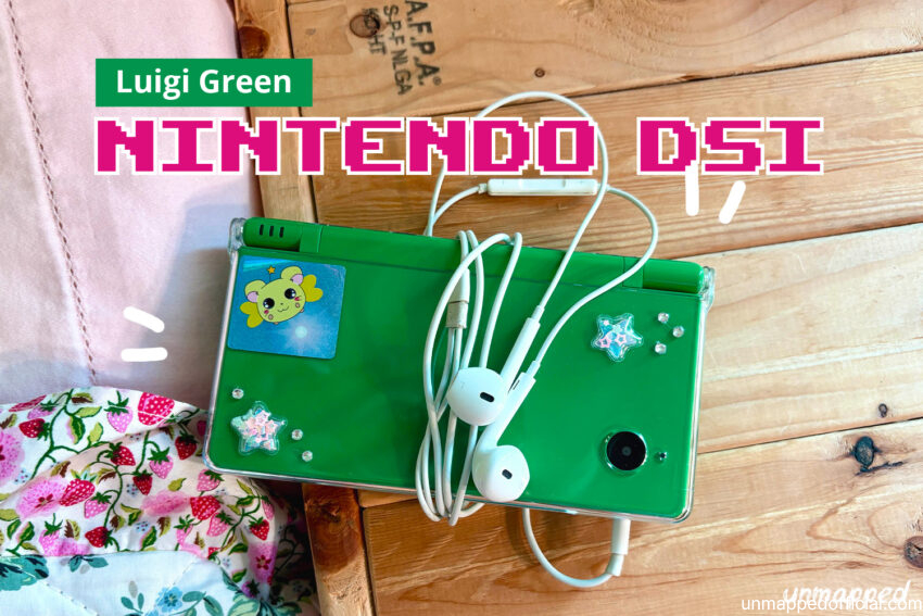 luigi green nintendo dsi with headphones and stickers