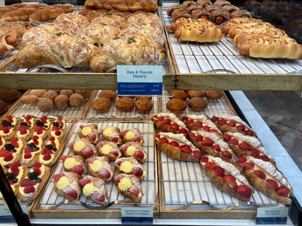 colorful delicious pastry items in a bakery display window box