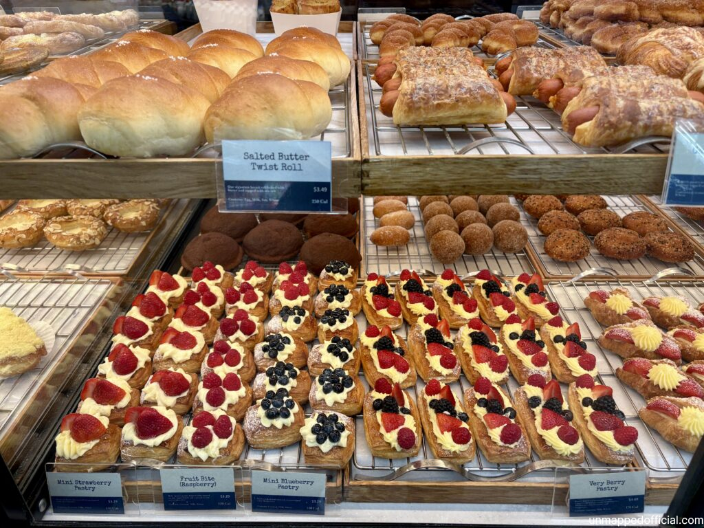 colorful delicious pastry items in a bakery display window box