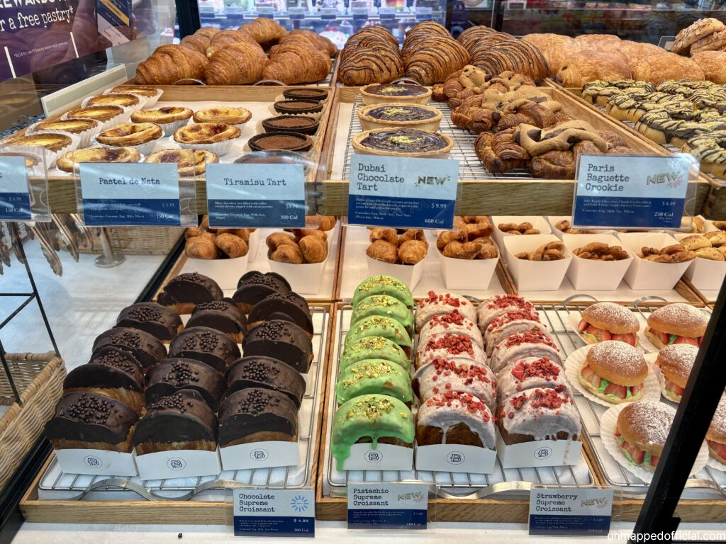 colorful delicious pastry items in a bakery display window box