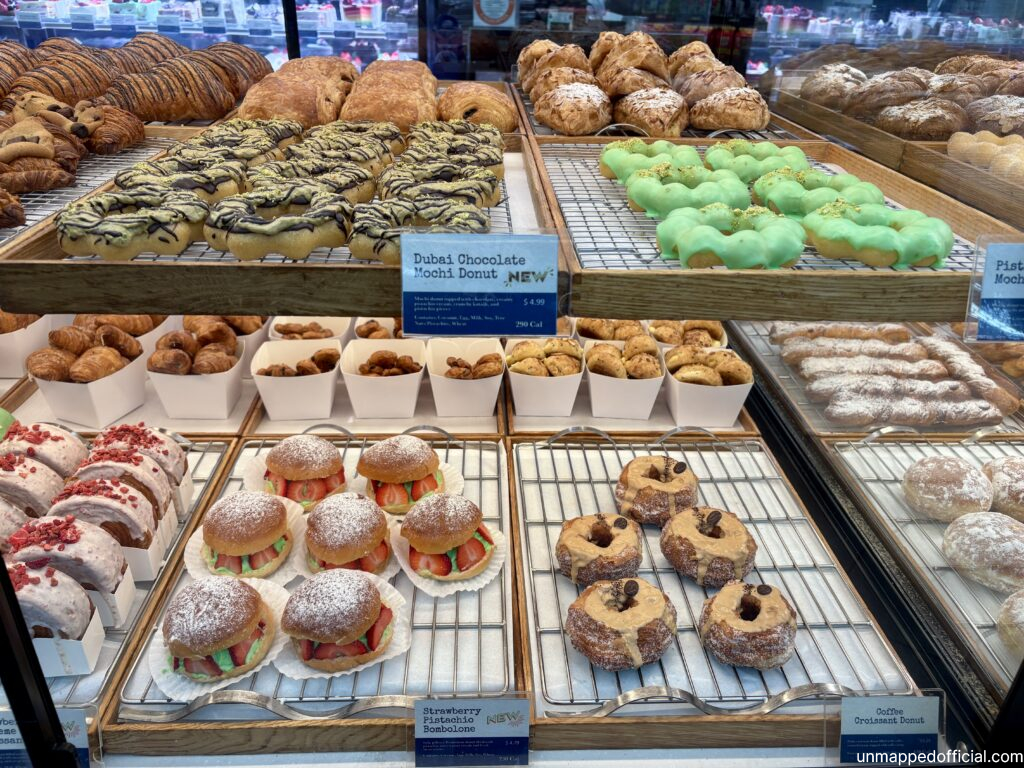 colorful delicious pastry items in a bakery display window box