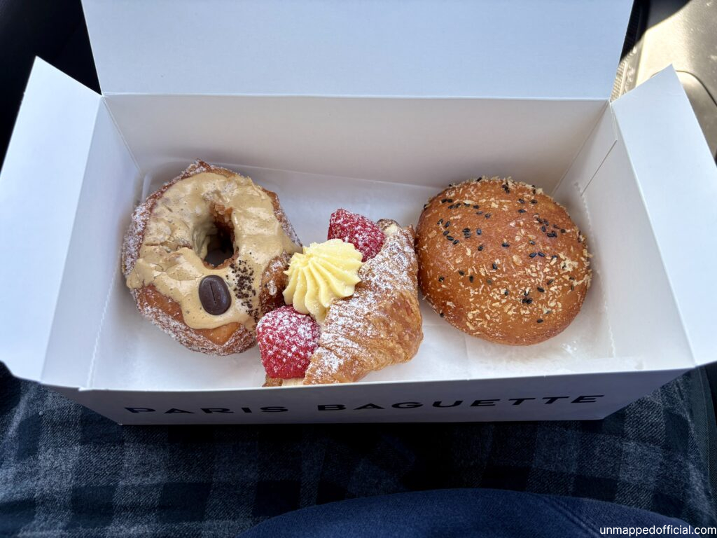 box of pastries in lap