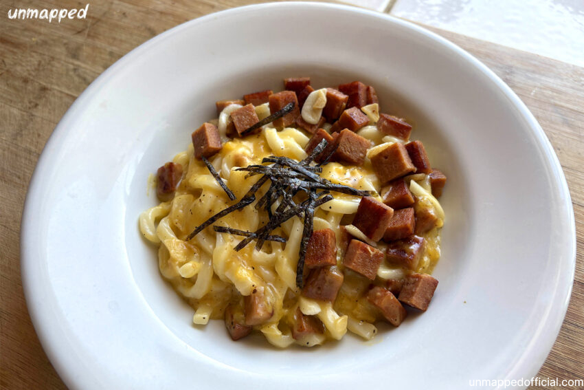 udon carbonara noodles in a white plate