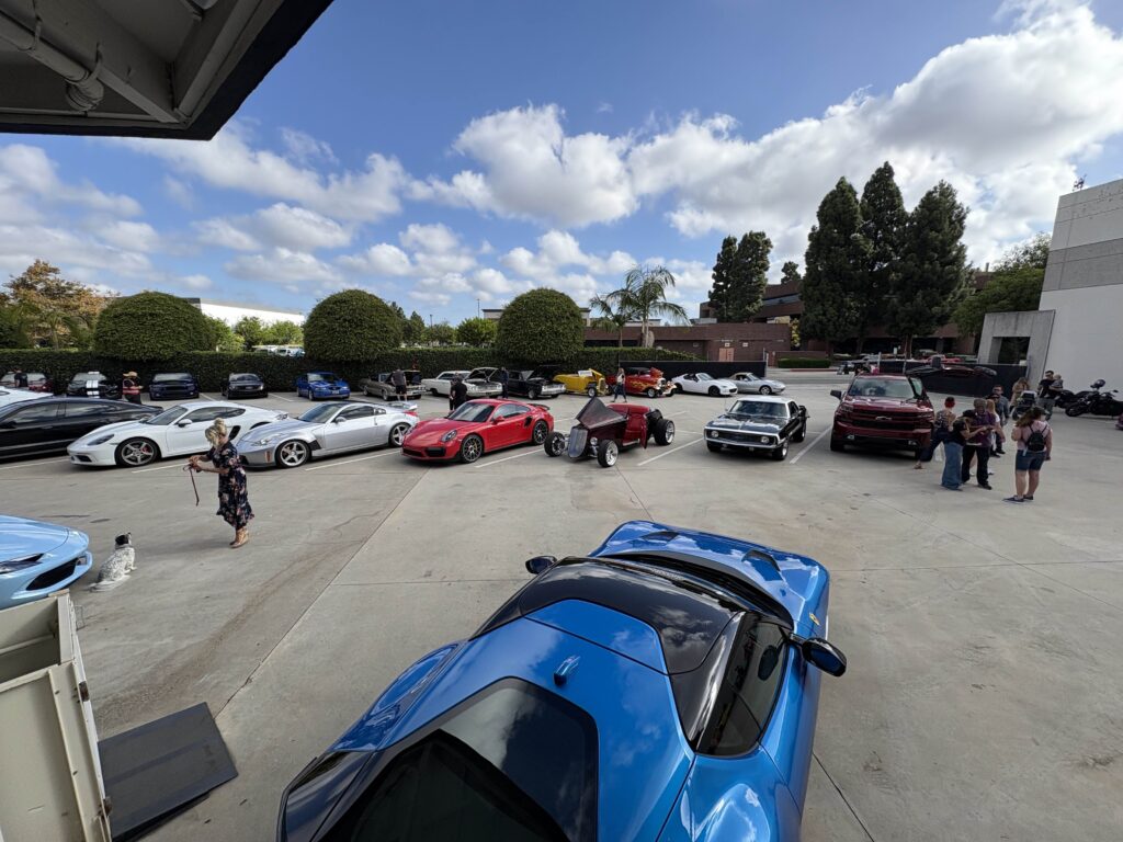 the car show heels and wheels parking lot with my miata in the back, next to another miata