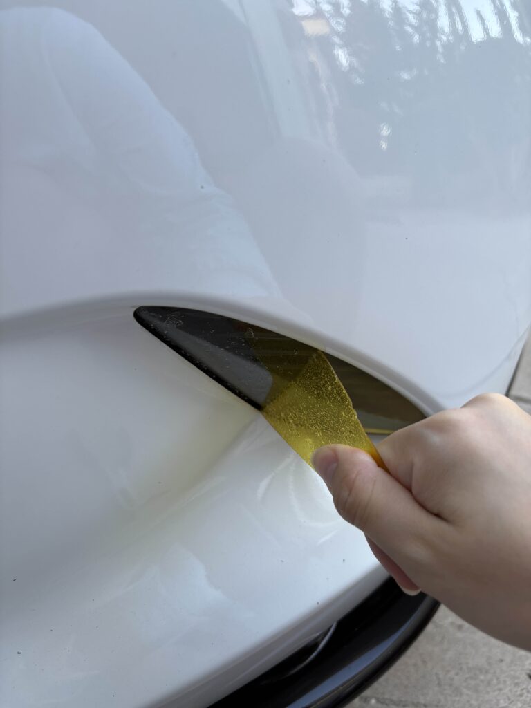 removing laminx film with hands